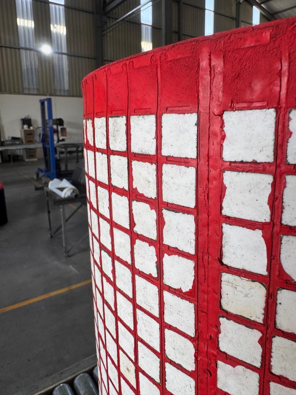 Close-up of ceramic tiles bonded into rubber wear panel