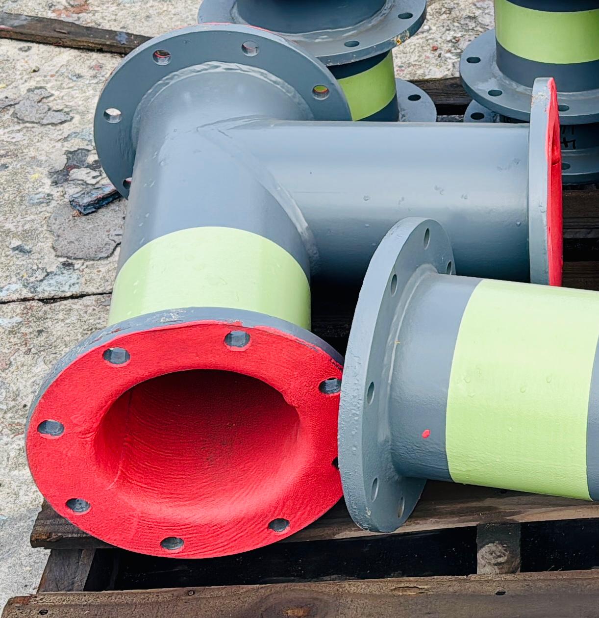 Completed red rubber lined pipes for platinum mine delivery